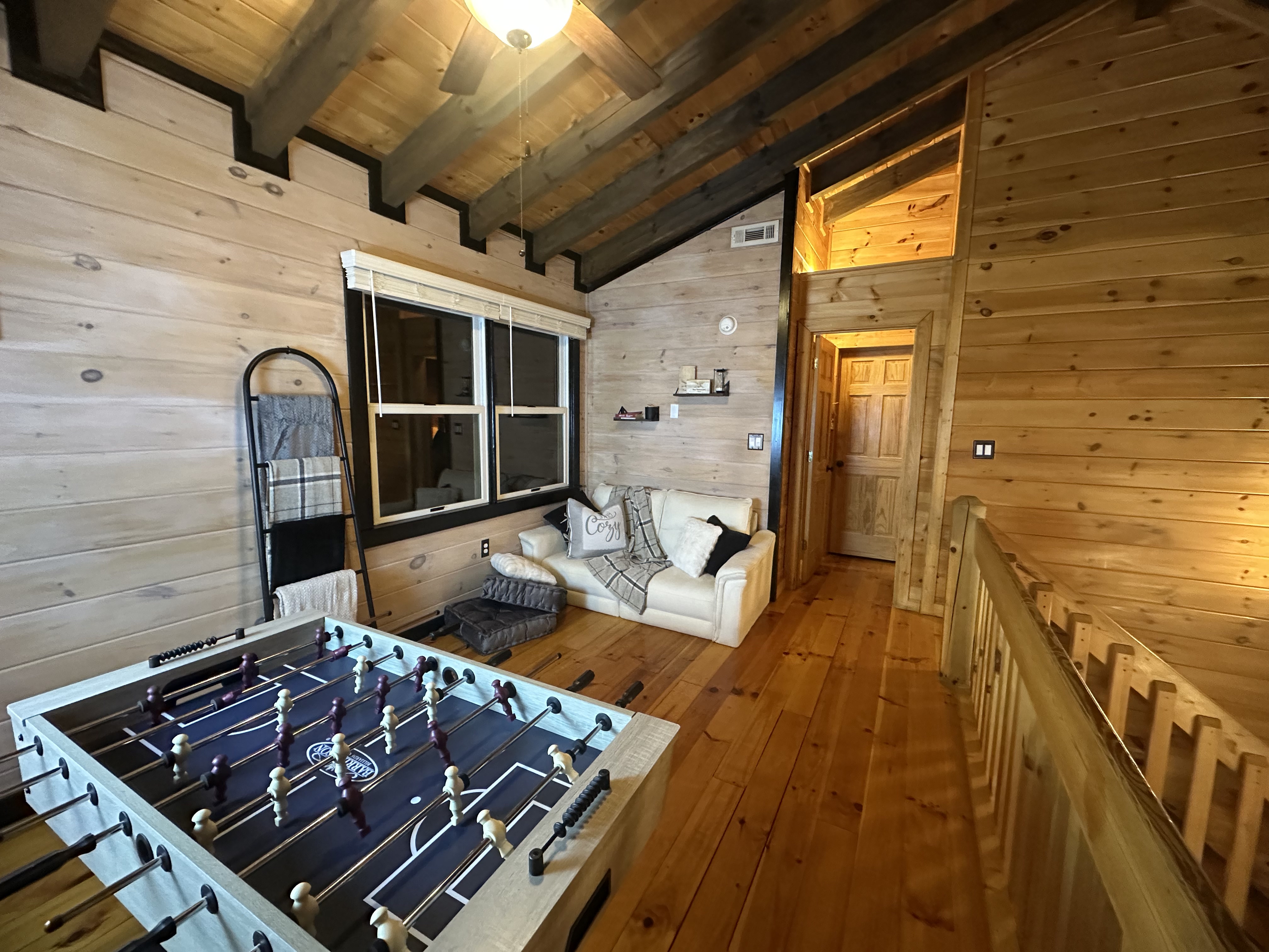 Foosball, lounge space, and a reading nook — the loft earns its keep.